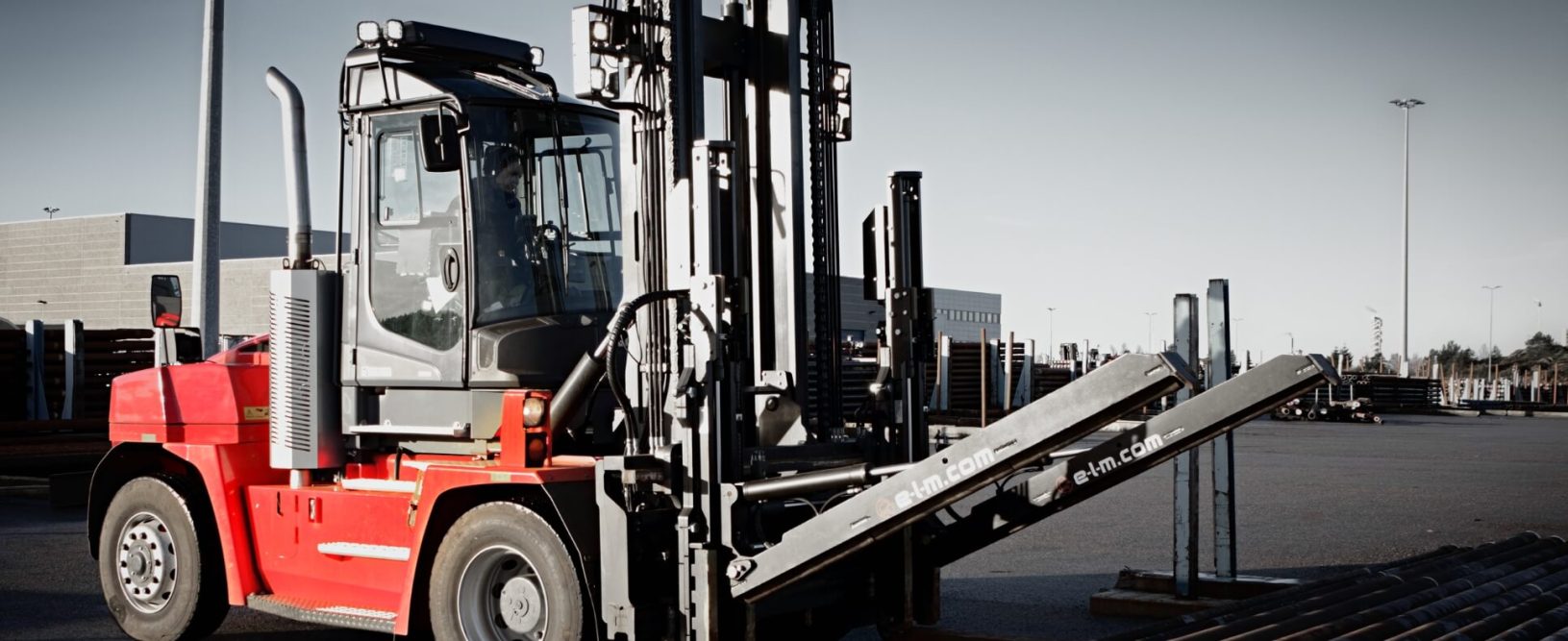 A red forklift in a lot